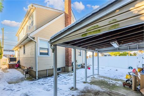 Cape-style single-family home situated on a quiet corner lot in the heart of Min